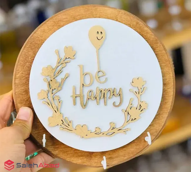 فروش عمده جاکلیدی چوبی دیواری گرد طرح be Happy