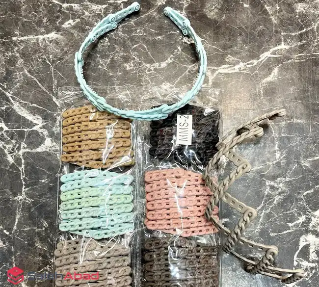 فروش عمده تل مو پلاستیکی رنگی مدل تاشو