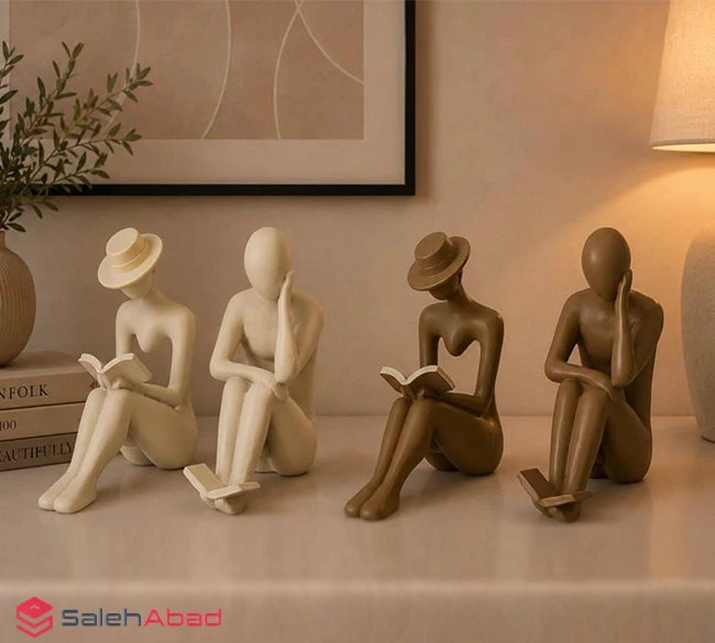 فروش عمده مجسمه زوج کتابخوان پلی استر
